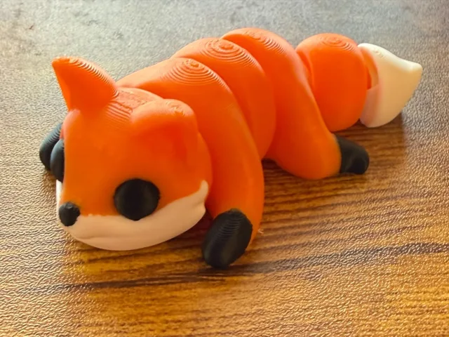 Orange, black, and white articulated fox 3D print